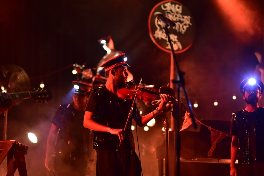 Pritam Deb Sarkar Live Stage Performance Amber Lighting with Band